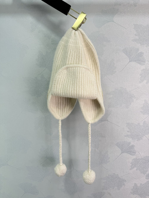 Chanel Stylish Knitted Cap with Double C Logo and Pom-poms for Sophisticated Flair